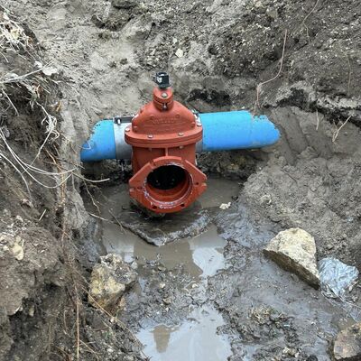 Tapping and setting new 8" water valve